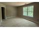 A bright bedroom with large windows offering natural light and an en-suite bathroom at 150 Asa Moseley Rd, Mcdonough, GA 30252