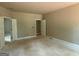 Spacious bedroom featuring neutral walls, unfinished floors, and two closets at 150 Asa Moseley Rd, Mcdonough, GA 30252