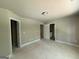Large bedroom with neutral paint, multiple doorways, and access to a bathroom at 150 Asa Moseley Rd, Mcdonough, GA 30252
