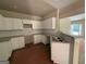 Modern kitchen with white cabinets, granite countertops, and stainless steel sink at 150 Asa Moseley Rd, Mcdonough, GA 30252