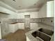 Functional kitchen featuring ample white cabinets, granite counters, and stainless steel sink at 150 Asa Moseley Rd, Mcdonough, GA 30252