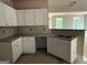 Kitchen area with bright white cabinetry, granite countertops, and a convenient breakfast bar at 150 Asa Moseley Rd, Mcdonough, GA 30252