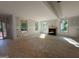 Bright living room with a fireplace and multiple windows, offering views of the surrounding landscape at 150 Asa Moseley Rd, Mcdonough, GA 30252