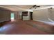 Bright open-concept living space with wood floors and an adjacent modern kitchen at 150 Asa Moseley Rd, Mcdonough, GA 30252