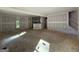 Spacious living area showcasing an open floor plan with easy access to the kitchen and outdoor spaces at 150 Asa Moseley Rd, Mcdonough, GA 30252