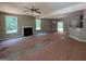 Living room with fireplace, lots of natural light, and open access to the kitchen at 150 Asa Moseley Rd, Mcdonough, GA 30252