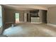 An open-concept living room space featuring view into kitchen area and access to exterior at 150 Asa Moseley Rd, Mcdonough, GA 30252