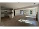 Open-concept living space with abundant natural light, fireplace, and seamless flow to the kitchen area at 150 Asa Moseley Rd, Mcdonough, GA 30252