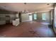 Open living area features white kitchen, wood flooring, and a fireplace at 150 Asa Moseley Rd, Mcdonough, GA 30252