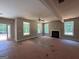 Living room with fireplace, lots of natural light, and open access to the entry door at 150 Asa Moseley Rd, Mcdonough, GA 30252