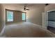 Bright main bedroom with two windows and an adjacent bathroom at 150 Asa Moseley Rd, Mcdonough, GA 30252