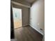 Mudroom area with wood-look floors and a laundry area visible through the doorway at 150 Asa Moseley Rd, Mcdonough, GA 30252