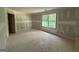 A bedroom with an open door and a large window at 150 Asa Moseley Rd, Mcdonough, GA 30252