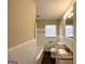Clean bathroom with a granite countertop vanity and tiled tub at 3006 Remington St, East Point, GA 30344