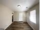 Simple dining area with hardwood floors and access to other rooms at 3006 Remington St, East Point, GA 30344
