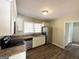 Modern kitchen with stainless steel appliances and granite countertops at 3006 Remington St, East Point, GA 30344
