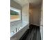 Bathroom features a large window above the soaking tub and a separate shower area at 136 Asa Moseley Rd, Mcdonough, GA 30252