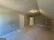 Neutral bedroom, including a light fixture and two doors at 136 Asa Moseley Rd, Mcdonough, GA 30252