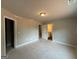 Bedroom featuring two doorways, one leading to an ensuite bathroom, with room to customize at 136 Asa Moseley Rd, Mcdonough, GA 30252