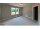 Bedroom features a window with natural light and a doorway to a walk-in closet at 136 Asa Moseley Rd, Mcdonough, GA 30252