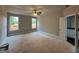 Bedroom features two windows providing natural light with access to an ensuite bathroom at 136 Asa Moseley Rd, Mcdonough, GA 30252