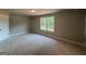 Bedroom with a light fixture and a large window at 136 Asa Moseley Rd, Mcdonough, GA 30252