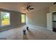 Spacious bedroom featuring a ceiling fan and natural light from two large windows at 136 Asa Moseley Rd, Mcdonough, GA 30252