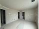 Spacious bedroom with multiple doors and drywall waiting to be finished and painted at 136 Asa Moseley Rd, Mcdonough, GA 30252