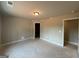 Spacious bedroom with multiple doorways providing access to other areas of the home at 136 Asa Moseley Rd, Mcdonough, GA 30252