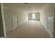 Large bonus room with drywall ready to be finished and doors on either side of the room at 136 Asa Moseley Rd, Mcdonough, GA 30252
