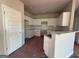 Well-lit kitchen features white cabinets, granite countertops, stainless sink and subway tile backsplash at 136 Asa Moseley Rd, Mcdonough, GA 30252