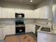 Well-equipped kitchen features stainless steel appliances, granite countertops, and ample white cabinetry at 136 Asa Moseley Rd, Mcdonough, GA 30252
