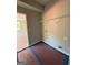 Small laundry room with wire shelving and electrical and water connections at 136 Asa Moseley Rd, Mcdonough, GA 30252