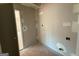 Unfinished laundry room featuring stubbed water lines and electrical outlets in the wall at 136 Asa Moseley Rd, Mcdonough, GA 30252