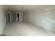 Spacious living room features neutral walls, multiple doors, and recessed lighting at 136 Asa Moseley Rd, Mcdonough, GA 30252