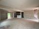 Spacious unfinished living room features staircase and large doorways leading to other rooms, perfect for customization at 136 Asa Moseley Rd, Mcdonough, GA 30252