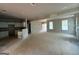 Unfinished living room and kitchen area with ample natural light, ready for personalization and finishing touches at 136 Asa Moseley Rd, Mcdonough, GA 30252