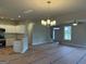Bright, open space featuring a modern light fixture and a view of the staircase and front door at 136 Asa Moseley Rd, Mcdonough, GA 30252
