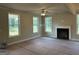 A cozy living room filled with natural light from the numerous windows and a fireplace at 136 Asa Moseley Rd, Mcdonough, GA 30252