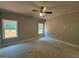 Bright bedroom with two windows offering natural light and outdoor views at 148 Asa Moseley Rd, Mcdonough, GA 30252