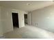 Bedroom featuring multiple doors, electrical outlets, and painted in neutral color at 148 Asa Moseley Rd, Mcdonough, GA 30252