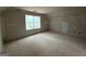 Bright bedroom featuring a large window and electrical outlets ready to customize at 148 Asa Moseley Rd, Mcdonough, GA 30252