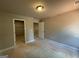 Neutral bedroom with doorway to closet and entrance to additional rooms at 148 Asa Moseley Rd, Mcdonough, GA 30252
