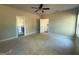 Spacious bedroom with a ceiling fan and two open doorways at 148 Asa Moseley Rd, Mcdonough, GA 30252
