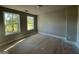 Bright bedroom featuring two large windows offering ample natural light and outdoor views at 148 Asa Moseley Rd, Mcdonough, GA 30252