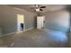 Spacious bedroom features a ceiling fan and doors to the bathroom and hallway at 148 Asa Moseley Rd, Mcdonough, GA 30252