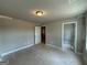 Bedroom featuring neutral walls with entry to closet and additional rooms at 148 Asa Moseley Rd, Mcdonough, GA 30252