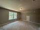 Bright bedroom with a large window offering natural light and comfortable living space at 148 Asa Moseley Rd, Mcdonough, GA 30252