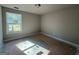 Bedroom features neutral walls and large window with natural light at 148 Asa Moseley Rd, Mcdonough, GA 30252