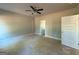Bright bedroom showcasing neutral walls, ceiling fan, and open doorway at 148 Asa Moseley Rd, Mcdonough, GA 30252